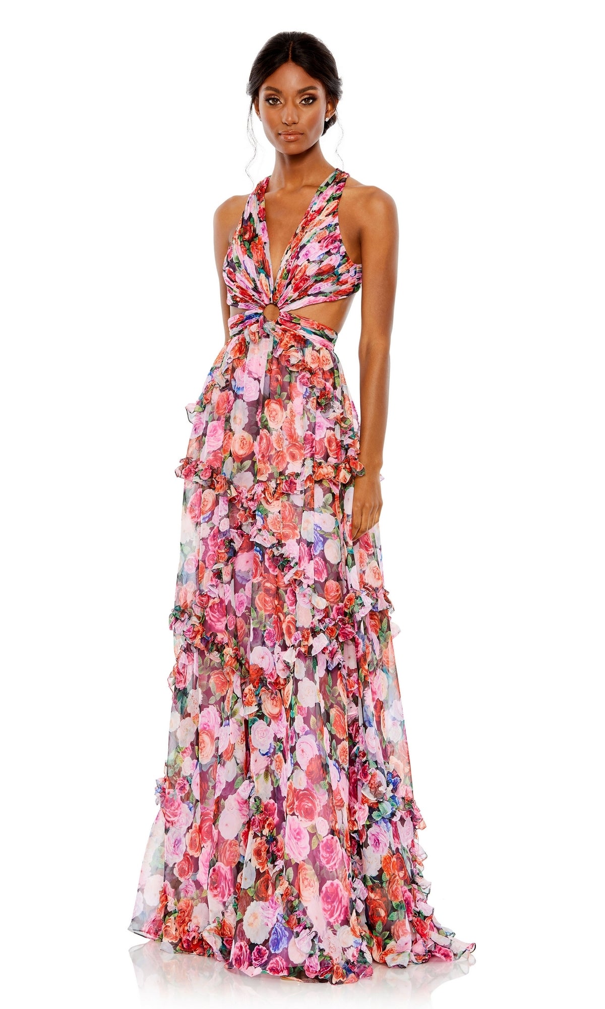 A woman models the Long Formal Dress 68076 by Mac Duggal, a sleeveless, floor-length floral print gown with a deep V-neck, cutout sides, and tiered ruffles, against a white background.